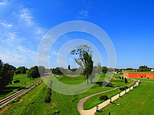 A superb park with ancient walls, railway and pedestrian way in Zamosc in Poland