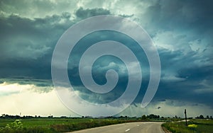 Supercell storm clouds with wall cloud and intense rain