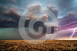 Supercell thunderstorm with dark storm clouds and lightning