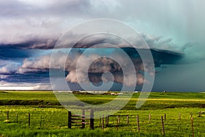 Ominous storm clouds over a field