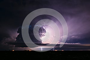 Supercell thunderstorm illuminated by lightning