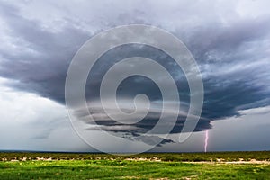 Supercell thunderstorm with lightning bolt.