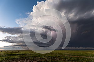 Supercell thunderstorm with lightning and dark storm clouds