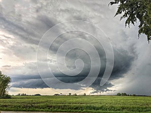 Supercell thunderstorm, severe weather over farm land in Illinois