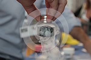 Superconductor levitating under magnets