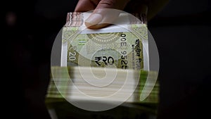 Superfast Indian currency notes counting by women hand.