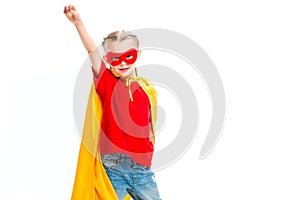 Supergirl wearing yellow cape and red mask for eyes gesturing by hand