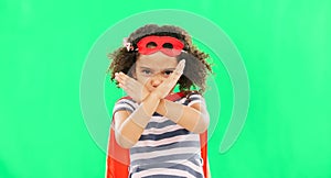 Superhero, child and stop sign on green screen with hands to fight crime with fantasy or cosplay costume. Girl power