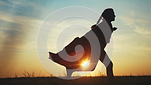 superhero kid run in the park. happy family play kid dream concept. happy child girl silhouette a raincoat run in park