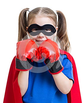 Superhero kid wearing boxing gloves