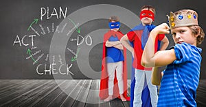 Superhero kids and king crown boy with blackboard background and plan graphics