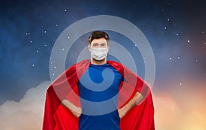 Superhero man in face protective mask at night