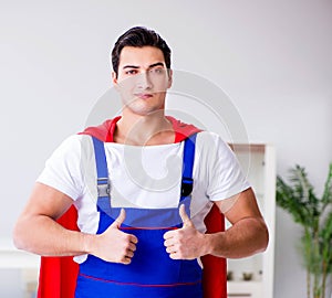 Superhero repairman with tools in repair concept