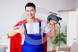 The superhero repairman with tools in repair concept