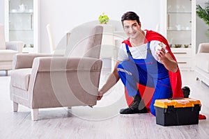 The superhero repairman with tools in repair concept