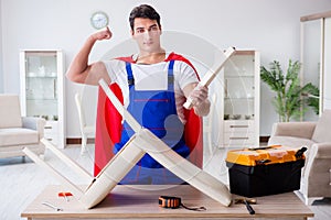 The superhero repairman with tools in repair concept