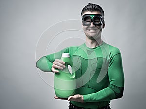 Superhero showing an eco-detergent for laundry