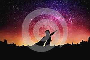 Superhero silhouette at the night starry sky background