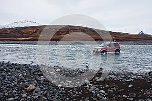 Superjeep crossing a glacial river in Iceland