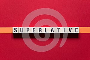 Superlative - word concept on cubes