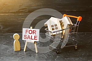 Supermarket cart with houses and man with a poster for sale. The concept of selling a home, real estate services or buying from