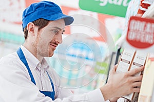 Supermarket clerk at work