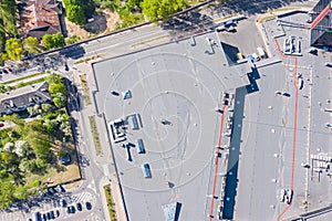 Supermarket complex with parking lot in city residential area. aerial top view