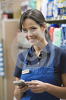 Supermarket Employee In Blue Apron photo