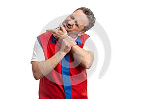 Supermarket employee cracking jaw joints