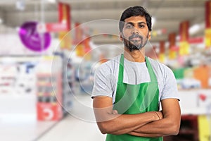 Supermarket employee portrait with crossed arms