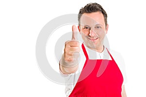 Supermarket employee showing thumbs up