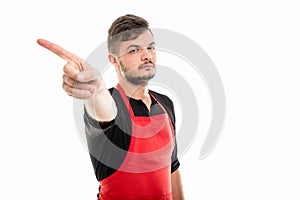 Supermarket employer showing denial gesture