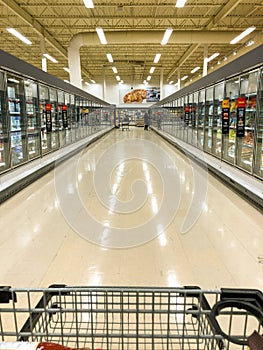 Supermarket - Grocery store with frozen food section aisle - Editorial image