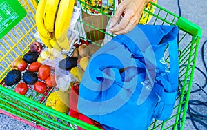 Supermarket from the inside Shelves Goods People Shopping carts Products