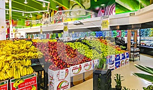 Supermarket from the inside Shelves Goods People Shopping carts Products