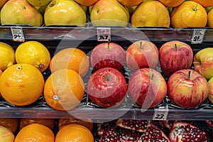 supermarket shelf full of fruits