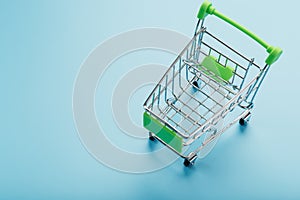 Supermarket shopping cart isolated on blue background