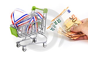 Supermarket shopping cart isolated with a Irish tricolor ribbon, concept of cost of life