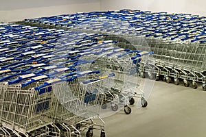 Supermarket shopping carts lined up empty