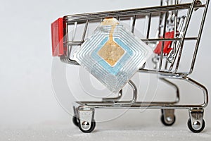 Supermarket trolley and RFID tag. Shoplifting Prevention. Goods security and alarm. Free space for an inscription. Light