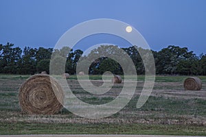 Supermoon over hay bales