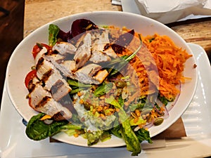 Superpower salad bowl with lettuce, carrot and chicken