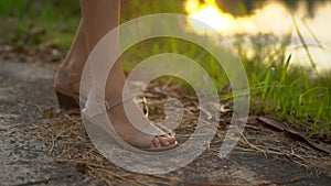 Superslowmotion shot of a beautiful young woman applying an antimosquito repellent spray on her skin. A tropical