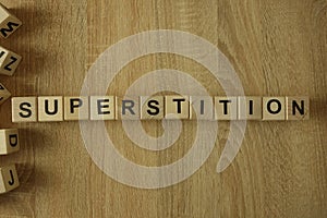Superstition word from wooden blocks