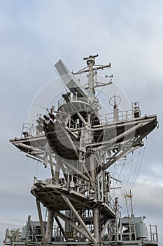 Superstructure of a warship against a blue sky