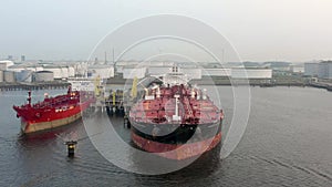 Supertanker Ship Docked in Rotterdam Offloading Goods and Cargo