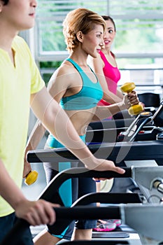 Supervision of sportive people training on treadmill