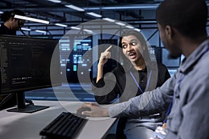 Supervisor berating employee after failing to optimize server room photo