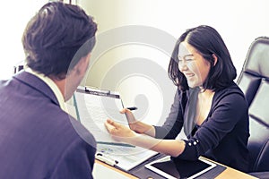 Supervisor explaining job contract to new employee with welcome happy emotion