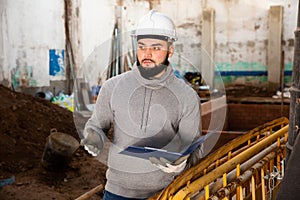 Supervisor inspecting process of building overhaul